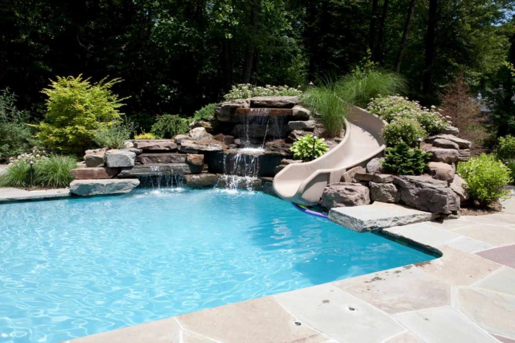 Swimming in Style: How Custom Pool Designers Create Backyard Art You Can Swim In